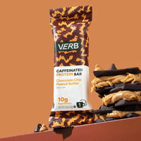 Verb caffeinated protein bar with chocolate chip and peanut butter flavor on an orange background