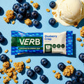 VERB Blueberry Crisp energy bar surrounded by blueberries, cereal pieces, and ice cream on a blue background