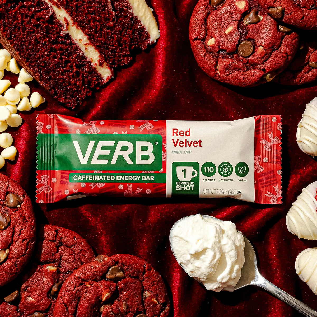 Red Velvet energy bar surrounded by red velvet cookies and cream on a red background